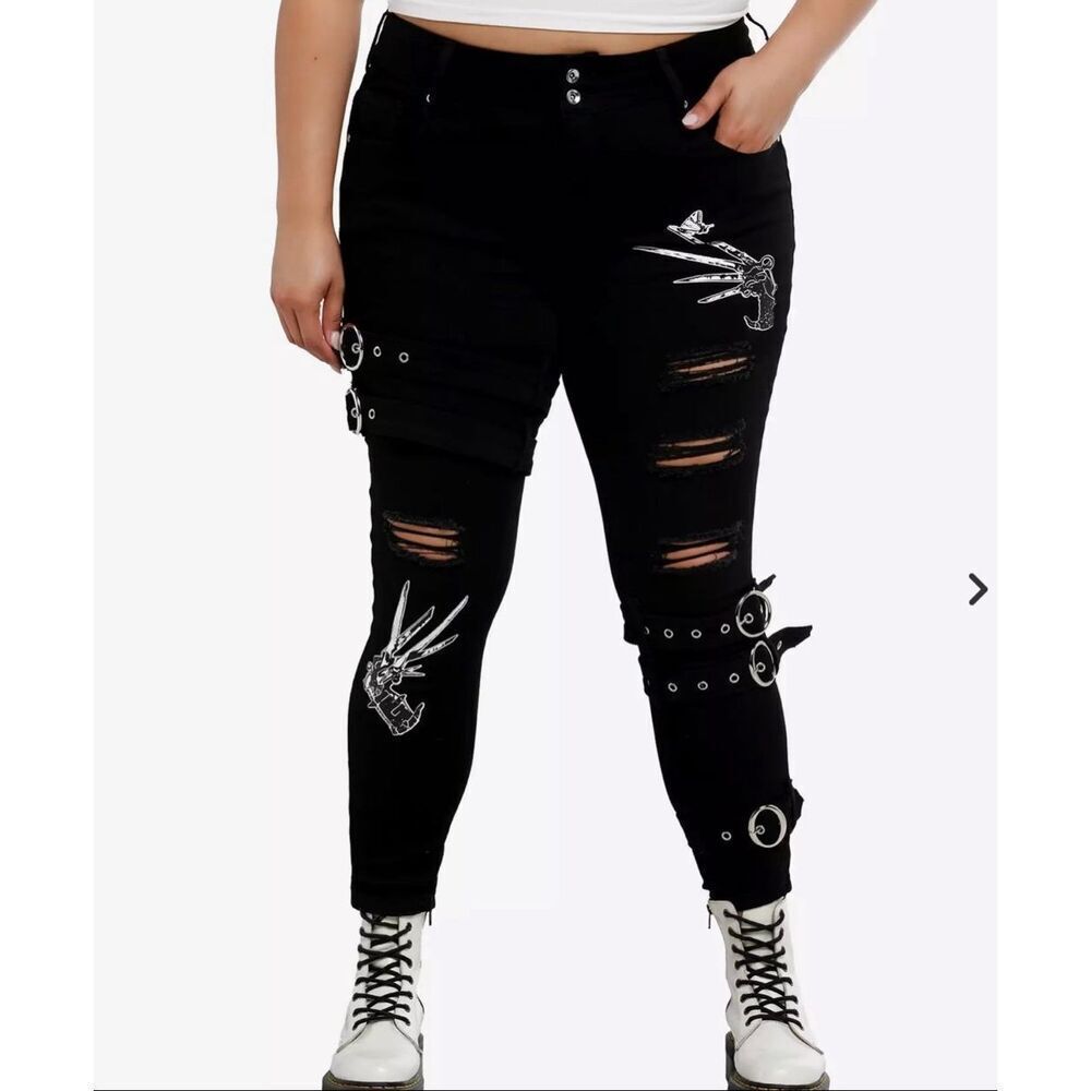 Her UniverseโEdward Scissorhands Grommet Strap Scissors Destructed Skinny Jeans